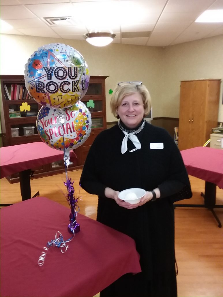 administrator Julie with balloons
